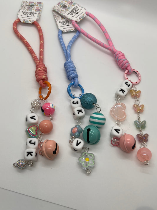 V and JK bag charms
