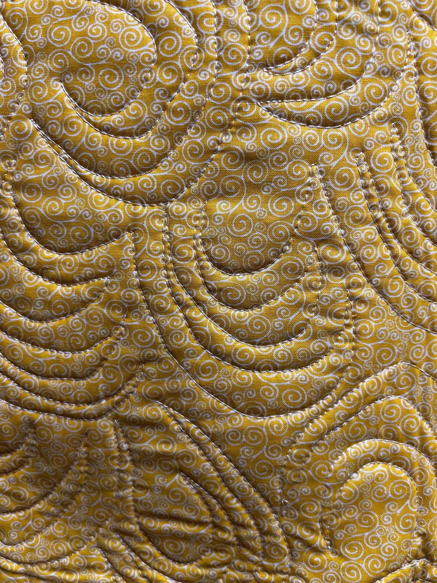 Handmade quilted baby blanket with bumblebees, flowers and yellow background