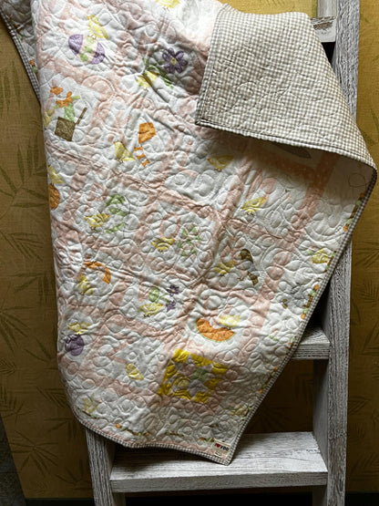 Handmade quilted baby blanket with alphabets, animals, light pastel colors