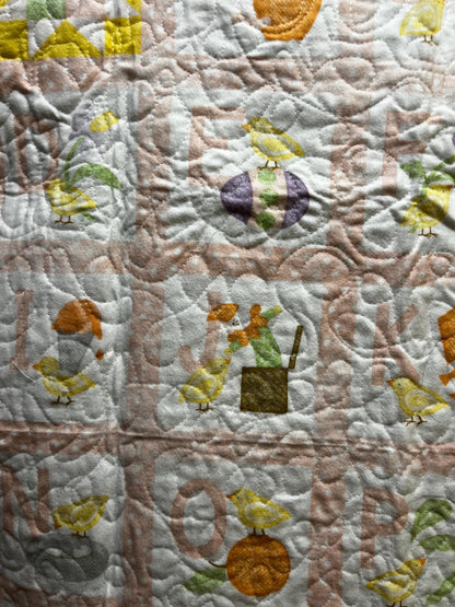 Handmade quilted baby blanket with alphabets, animals, light pastel colors